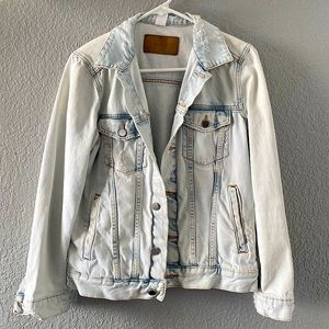 Distressed light blue denim jacket
